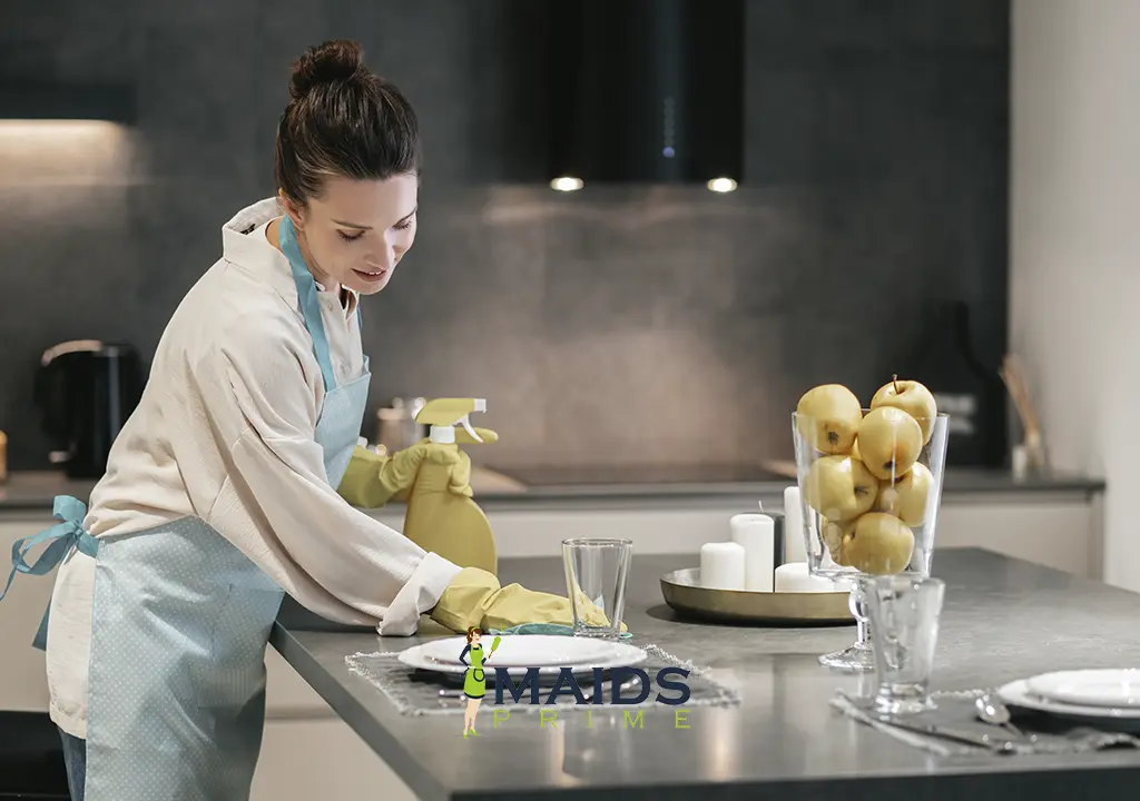 a Woman cleaning marble countertop